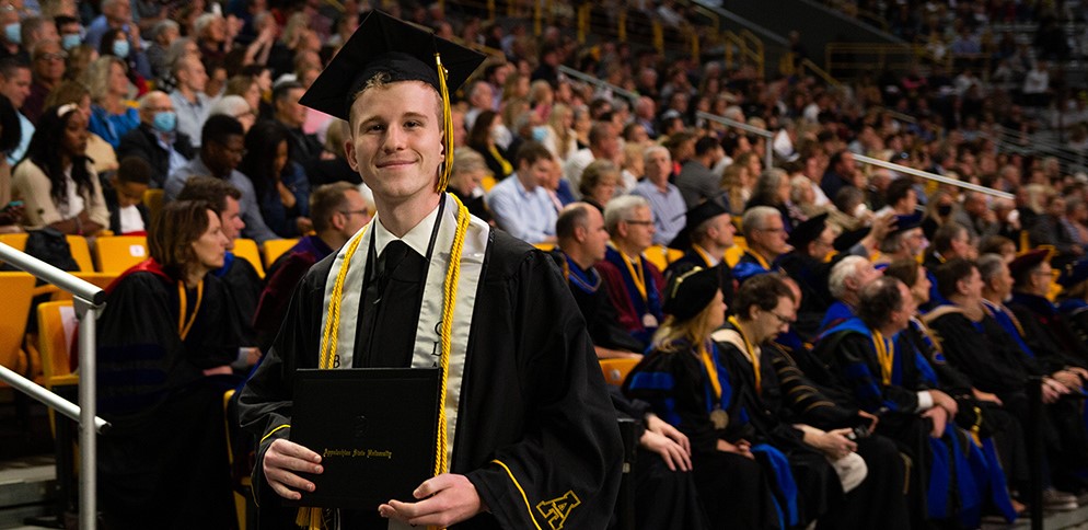 App State graduate shows off his diploma