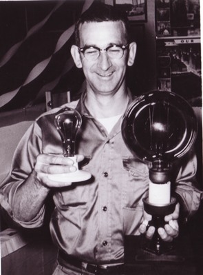 Grant Ayers with light bulbs, c. 1950s Grant Ayers with light bulbs, c. 1950s