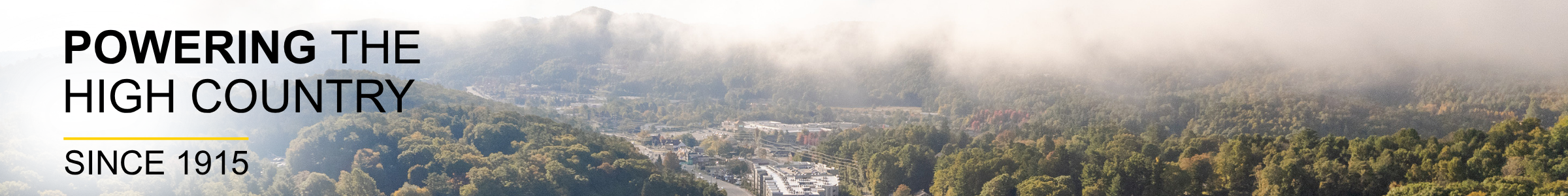 Aerial of Boone with fog rolling in.